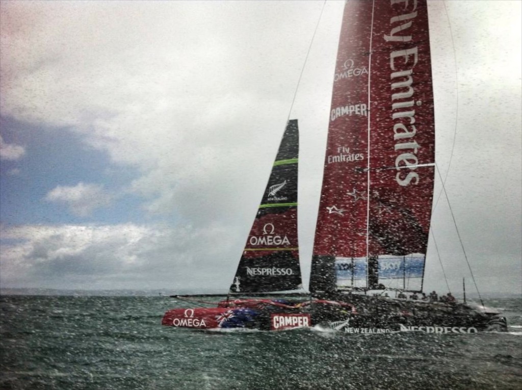 Emirates Team NZ heads upwind into 25kt winds and rain squalls. The AC72 just hurtles up the course in these conditions - an amazing piece of sailing engineering. © Chris Cameron/ETNZ http://www.chriscameron.co.nz